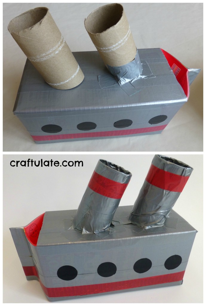 Homemade boat made from milk carton, tape, and toilet paper rolls