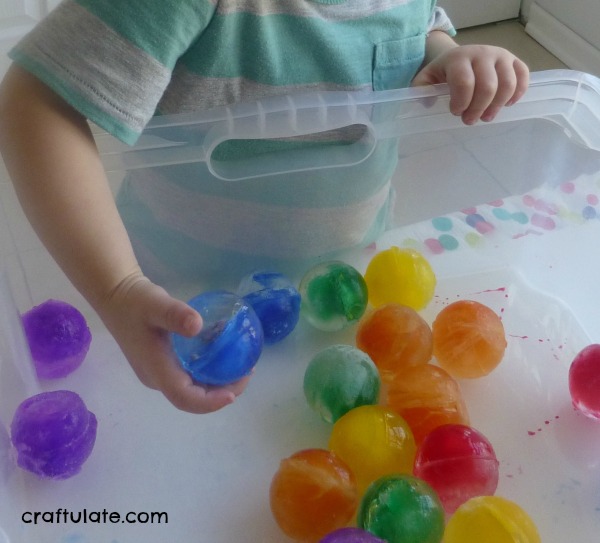 Rainbow Ice Ball Sensory Bin - Craftulate